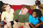 Black and white people together laughing, smiling.
